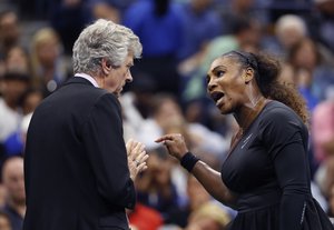 Serena Williams, right, talks with referee Brian Earley during the women's final of the U.S. Open tennis tournament against Naomi Osaka, of Japan, Saturday, Sept. 8, 2018, in New York.