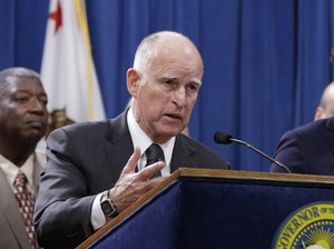 California Gov. Jerry Brown discusses proposed legislation to increase the state's minimum wage to $15 per hour by 2022, during a news conference in Sacramento, Calif. Monday March 28, 2016.