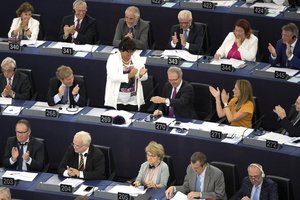 European Parliament members applaud rapporteur Germany's Axel Voss (270) after a vote on copyrights in Strasbourg, eastern France, Wednesday, Sept. 12, 2018