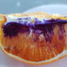 Mystery surrounds orange that turned purple overnight