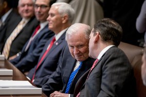 Attorney General Jeff Sessions, second from right, and Labor Secretary Alex Acosta, right, speak together during a cabinet meeting in the Cabinet Room of the White House, Thursday, Aug. 16, 2018, in Washington.