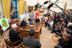 President Donald J. Trump, joined by Vice President Mike Pence and White House senior staff, receives an briefing on the approach of Hurricane Florence toward the east coast of the United States Tuesday, Sept. 11, 2018, in the Oval Office of the White House.