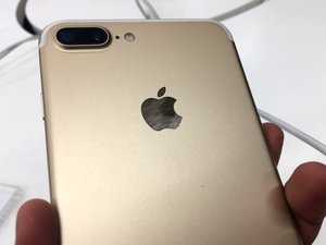 Apple iPhone in gold cover at an Apple shop. Taken on November 2017.