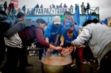 Argentines cook meatballs and rice in the middle of a Buenos Aires boulevard as a protest against new austerity measures.