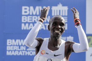 Eliud Kipchoge celebrates winning the 45th Berlin Marathon in Berlin, Germany, Sunday, Sept. 16, 2018. Eliud Kipchoge set a new world record in 2 hours 1 minute 39 seconds.