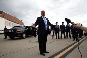 File - President Donald Trump speaks to the media after he steps off Air Force One, Tuesday, Aug. 21, 2018, in Charleston, W.Va. Trump says the conviction of his former campaign chairman Paul Manafort on financial crimes is "a disgrace."