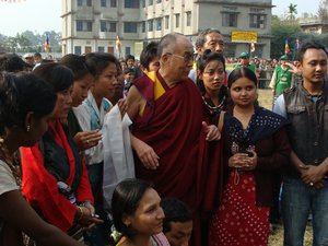 File - His Holiness the Dalai Lama with local leaders, teachers and students at Salugara Monastery