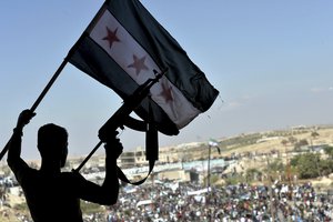 Thousands of protesters attend a demonstration against the Syrian government offensive to Idlib, in the northwestern town of Maarat al-Numan, also known as al-Maʿarra, south of Idlib, Syria, Friday, Sept 14, 2018.