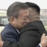 Kim and Moon embrace during high-stakes summit