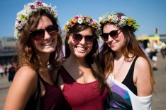 F2610E Berlin, Germany. 12th Sep, 2015. Camila, Alina and Giorgia from Switzerland pose with garlands in their hair at ...