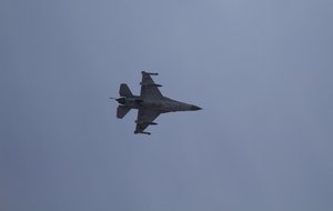 File - In this Nov. 18, 2012 file photograph, an Israeli F-16 jet fighter flies near the city of Ashdod, Israel.