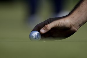 Tommy Fleetwood drops his ball near his marker before putting on the second green during the first round of the Northern Trust golf tournament, Thursday, Aug. 23, 2018, in Paramus, N.J.