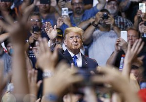 President Donald Trump waves to the cheering crowd as he arrives for a political rally, Thursday, Aug. 2, 2018, at Mohegan Sun Arena at Casey Plaza in Wilkes Barre, Pa.