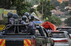 Ugandan riot police patrol on the streets of the Kamwokya neighborhood where pop star-turned-opposition lawmaker Bobi Wine, whose real name is Kyagulanyi Ssentamu, has his recording studio and many supporters, in Kampala, Uganda Thursday, Sept. 20, 2018