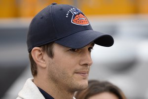 Ashton Kutcher walks along the sideline before the NFL football game between the Pittsburgh Steelers and the Chicago Bears at Heinz Field on Sunday, Sept. 22, 2013, in Pittsburgh.