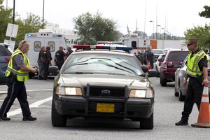 Aberdeen police officers blocks the entrance of industrial complex where several people had been shot, in Harford County, Md, Thursday, Sept. 20, 2018.