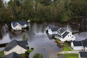 An aerial view shows severe flooding in a small community near Raleigh N.C., caused by Tropical Storm Florence, Sept. 16, 2018, while a Customs and Border Protection flight crew conducts search and rescue missions as well as damage assessments.