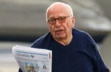 Rupert Murdoch pictured taking a morning walk on the tarmac around his private jet in Sydney. 