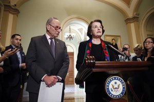 Senate Judiciary Committee Ranking Member Sen. Dianne Feinstein, D-Calif., speaks to the media, accompanied by Senate Minority Leader Chuck Schumer, D-N.Y., about the FBI report on sexual misconduct allegations against Supreme Court nominee Brett Kavanaugh, on Capitol Hill, Thursday, Oct. 4, 2018 in Washington.