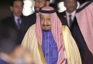 Saudi Arabia's King Salman walks upon his arrival at Haneda International Airport in Tokyo, Sunday, March 12, 2017.