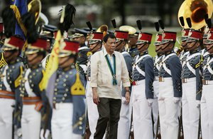 Philippine President Rodrigo Duterte inspects troops during the 81st anniversary of the Armed Forces of the Philippines at Camp Aguinaldo military headquarters in Quezon city, north of Manila, Philippines on Wednesday, Dec. 21, 2016.