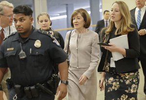 Sen. Susan Collins, R-Maine, is followed by members of the media as she walks to the Capitol before a vote to advance Brett Kavanaugh's nomination to the Supreme Court, on Capitol Hill, Friday, Oct. 5, 2018 in Washington.