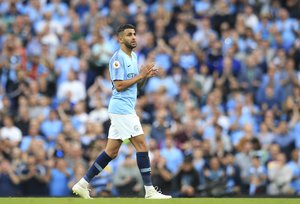 Manchester City's Riyad Mahrez applauds as he leaves the field to be substituted during the English Premier League soccer match between Manchester City and Newcastle United at the Etihad Stadium in Manchester, England, Saturday, Sept. 1, 2018.