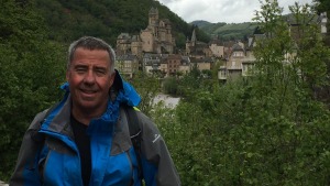 Ron Ehrlich pauses outside the French village of Estaing during his hike along the French Way.