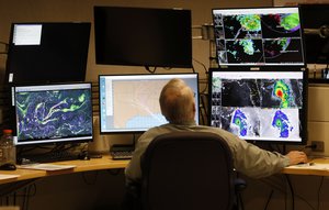 Senior Hurricane Specialist Stacy Stewart watches monitors at the National Hurricane Center, Tuesday, Sept. 4, 2018, in Miami.