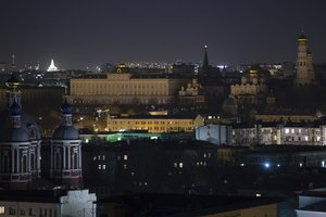 The Kremlin is seen in darkness after the lights were turned off to mark Earth Hour in Moscow, Russia, Saturday, March 25, 2017.