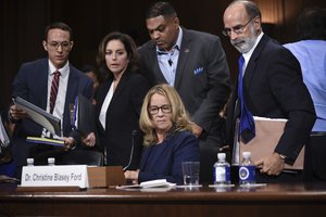 Christine Blasey Ford (C, seated), the woman accusing Supreme Court nominee Brett Kavanaugh of sexually assaulting her at a party 36 years ago, testifies before the US Senate Judiciary Committee on Capitol Hill in Washington, DC, September 27, 2018.