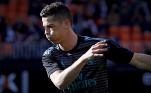 Cristiano Ronaldo warms up prior to the start of the Spanish La Liga soccer match between Valencia and Real Madrid at the Mestalla stadium in Valencia, Spain