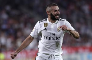 Real Madrid's Karim Benzema celebrates scoring his side's 4th goal during the Spanish La Liga soccer match between Girona and Real Madrid at the Montilivi stadium in Girona, Sunday, Aug. 26, 2018.