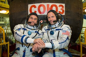 At the Baikonur Cosmodrome in Kazakhstan, Expedition 57 crew members Alexey Ovchinin of Roscosmos (left) and Nick Hague of NASA (right) pose for pictures in front of their Soyuz MS-10 spacecraft Sept. 26 during final pre-launch training.