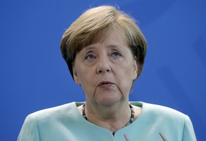 German Chancellor Angela Merkel addresses the media during a statement at the chancellery in Berlin, Germany, Friday, June 2, 2017 on the United States withdraw from the Paris climate accord.