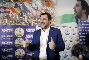 Right-wing, anti-immigrant and euroskeptic League's Matteo Salvini gives the thumbs up at the end of a press conference on the preliminary election results, in Milan, Monday, March 5, 2018.