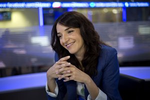 In this Sunday, April 13, 2015 photo, Arab newscaster Lucy Aharish smiles during an interview with The Associated Press in Tel Aviv, Israel