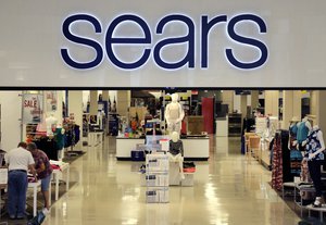 In this Tuesday, July 5, 2016, photo, customers shop at a Sears store in Salem, N.H.