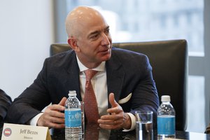 Amazon founder Jeff Bezos speaks during a meeting with President-elect Donald Trump