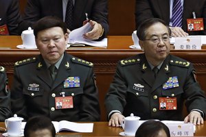 In this March 8, 2017, photo, Fang Fenghui, right, the then-chief of the general staff of the Chinese People's Liberation Army, right, and Zhang Yang, left, the then-head of China's People's Liberation Army (PLA) political affairs department attend the China's National People's Congress (NPC) at the Great Hall of the People in Beijing. China's ruling Communist Party on Tuesday, Oct 16, 2018 has expelled Zhang, a former top general who killed himself during a corruption probe and indicted another Fang, on graft charges amid a continuing crackdown on military malfeasance.  (AP Photo/Andy Wong, File)