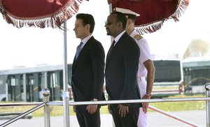 Italian Premier Giuseppe Conte, left, and Ethiopian Prime Minister Abiy Ahmed Ali stand attention at they review the guard of honor, in Addis Ababa, Ethiopia on the occasion of an official visit, Thursday Oct. 11, 2018.