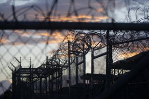 In this Nov. 21, 2013 file photo reviewed by the U.S. military, dawn arrives at the now closed Camp X-Ray, which was used as the first detention facility for al-Qaida and Taliban militants who were captured after the Sept. 11 attacks at Guantanamo Bay Naval Base, Cuba.