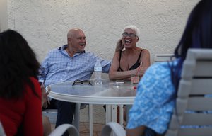 In this April 27, 2018, file photo, owner Dennis Hof, left, jokes with madam Sonja Bandolik at the Love Ranch brothel in Crystal, Nev.