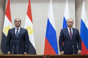 Russian President Vladimir Putin, right, and Egyptian President Abdel-Fattah el-Sisi pause during a minute of silence to commemorate the victims of an explosion in a vocational college in Crimea, during their talks in Sochi, Russia, Wednesday, Oct. 17, 2018.