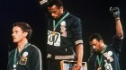 Tommie Smith (centre), and John Carlos salute after winning gold and bronze at the 1968 Olympics. Australian Peter ...