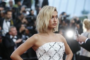 Model Hailey Baldwin poses for photographers upon arrival at the screening of the film The Beguiled at the 70th international film festival, Cannes, southern France, Wednesday, May 24, 2017.