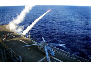 Super rapid bloom off board countermeasures (SRBOC) rockets launch from the amphibious assault ship USS Tarawa (LHA 1) during a test of the ship's anti-missile defense system.