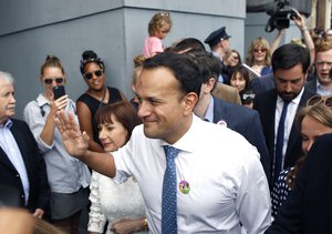 Ireland's Prime Minister Leo Varadkar, foreground, arrives at Dublin Castle for the results of the referendum on the 8th Amendment of the Irish Constitution which prohibits abortions unless a mother's life is in danger, in Dublin, Ireland, Saturday May 26, 2018.