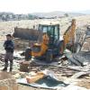 JCB vehicle demolishing buildings