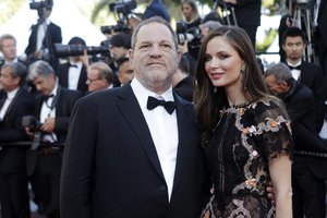 File - Producer Harvey Weinstein, left, and his wife Georgina Chapman pose for photographers upon arrival for the screening of the film The Little Prince at the 68th international film festival, Cannes, southern France, Friday, May 22, 2015.